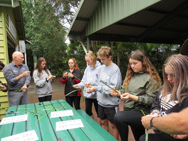 group of students participating in weaving class at Cherbourg
